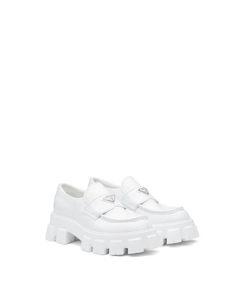 white Prada loafers